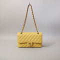 Chanel Classic Double Flap Bag finished in a vibrant yellow hue.