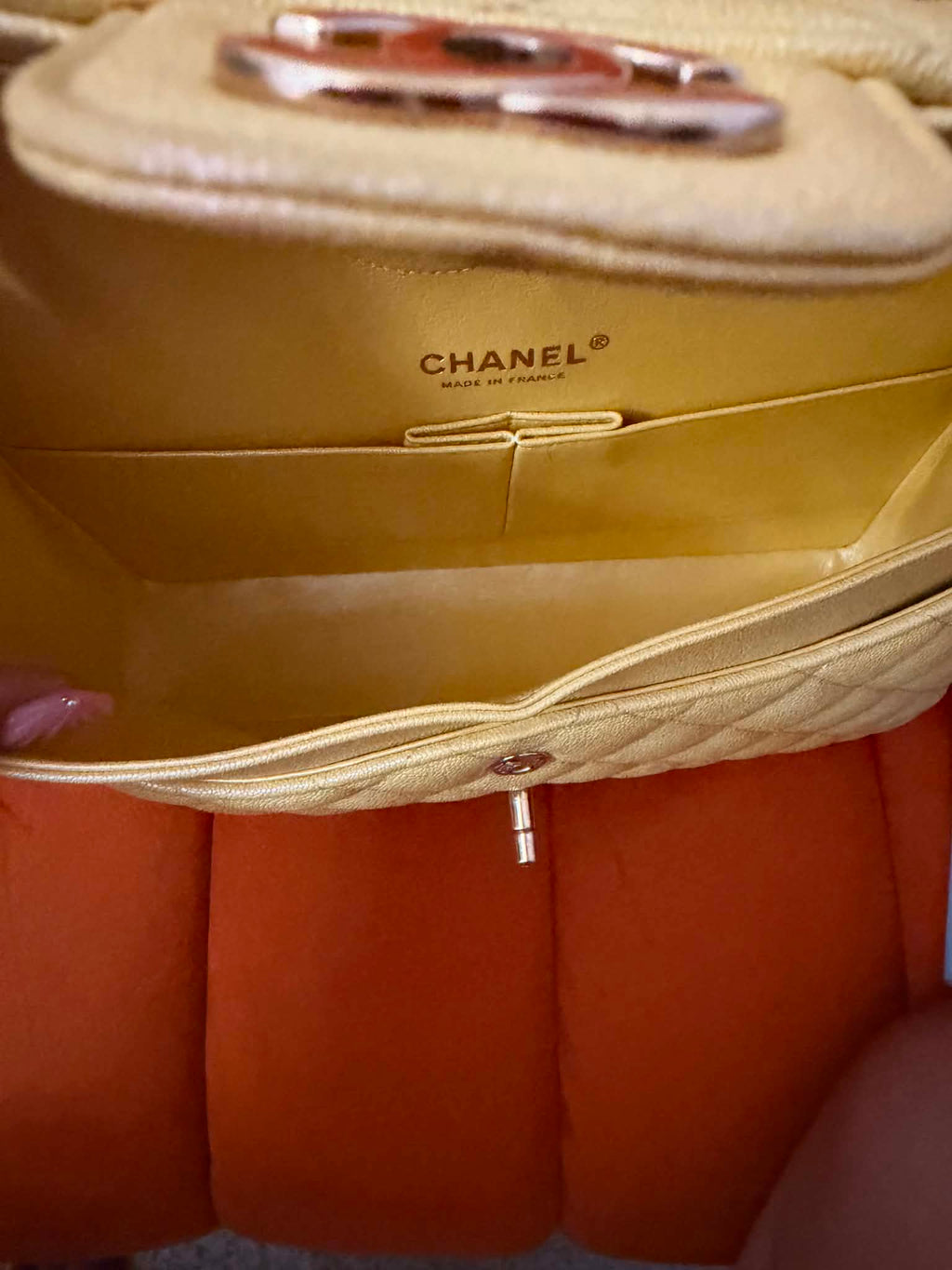 Chanel Classic Double Flap Bag finished in a vibrant yellow hue.