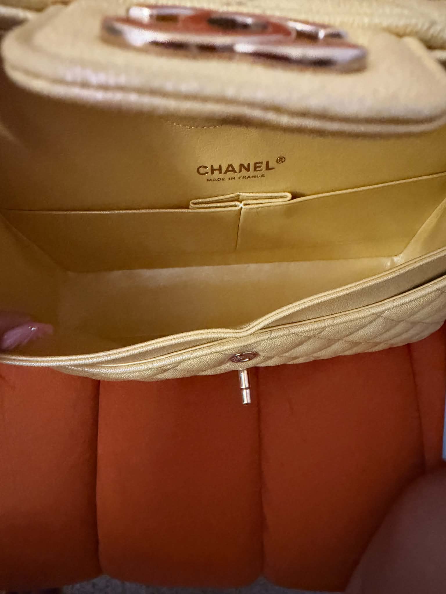 Chanel Classic Double Flap Bag finished in a vibrant yellow hue.