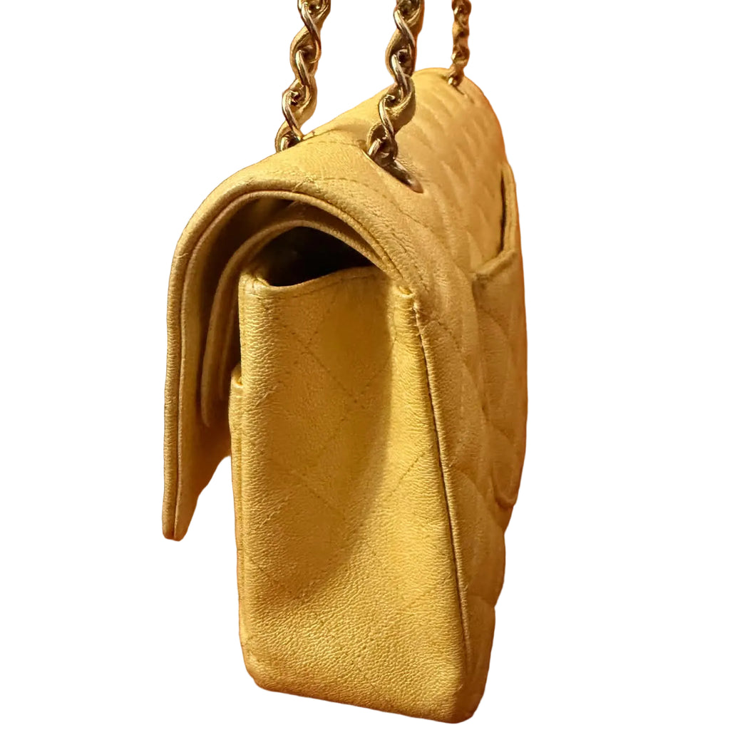 Chanel Classic Double Flap Bag finished in a vibrant yellow hue.
